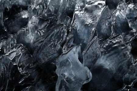 Ice cubes close-up. Abstract background for design. Toned.の素材