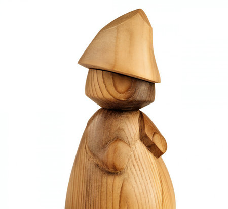 Wooden figurine of a man isolated on a white background.の素材