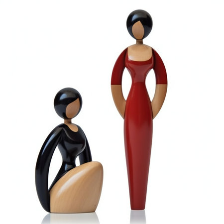 Figurines of a woman and a man on a white backgroundの素材