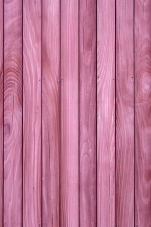 Pink wooden background with vertical planks. Wood texture for design and decoration.の素材