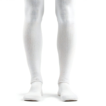 Female legs in white socks on a white background. Isolate.の素材