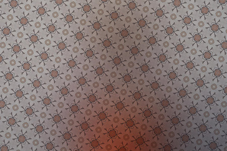 Textile cloth black and orange with a kaleidoscope pattern that can be used as a backgroundの写真素材