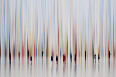 Abstract image of a group of people walking in a line in the cityの素材