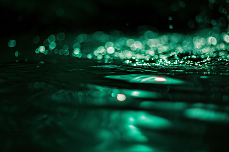 Abstract background with bokeh defocused lights and water ripplesの素材