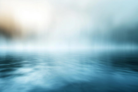 abstract blue background with smooth water surface and blurred bokehの素材