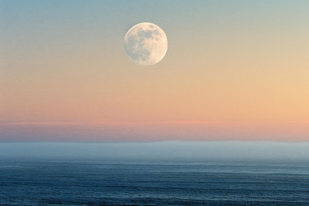 Full moon over the sea at sunset. Seascape with a full moon.の素材