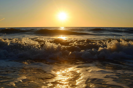 Sunset on the sea with waves and splashes of water.の素材