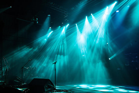 The concert of the rock band on the stage, illuminated by spotlightsの素材