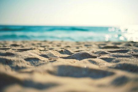 Close up of sand on the beach with sea and sky background.の素材