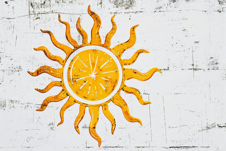 Sun with orange on white wooden background. Summer concept. Vintage style.の素材