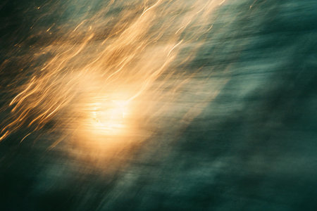 Abstract motion blur of water surface with sunbeams and lens flareの素材