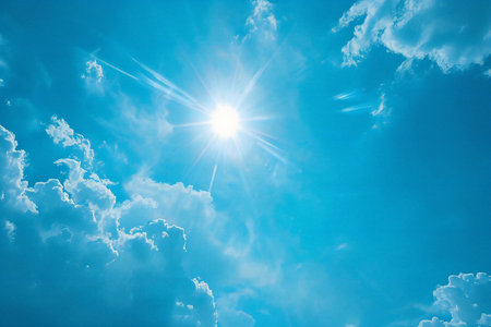Blue sky with white clouds and sun. Nature background. Blue sky with white clouds and sunの素材
