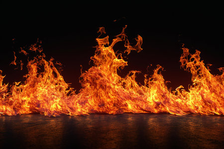 Fire flames isolated on black background. Abstract blaze of fire flame texture background.の素材