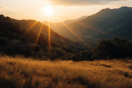 Sunset in the mountains. Beautiful summer landscape with sunbeamsの素材