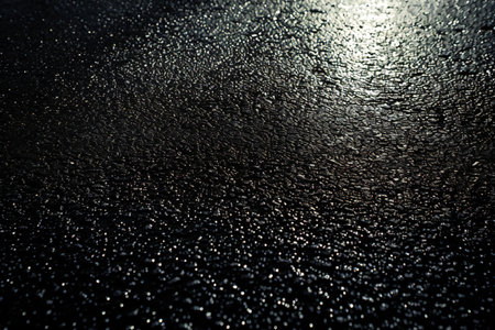 Raindrops on the asphalt. Abstract background and texture for design.の素材