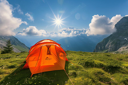 Camping in the mountains on the background of the sun and cloudsの素材