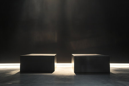 Two black podiums standing in a dark room illuminated by spotlightsの素材