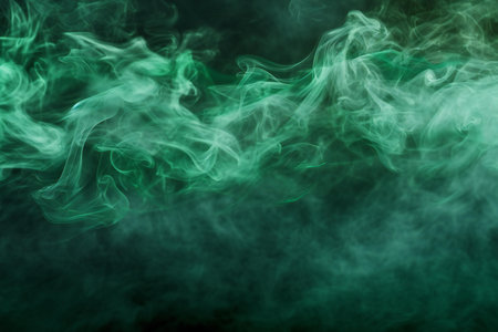 Green smoke isolated on black background. Abstract background. Texture of smoke vapeの素材