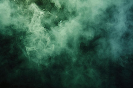Green and blue cloud of smoke on black background. Copy space.の素材
