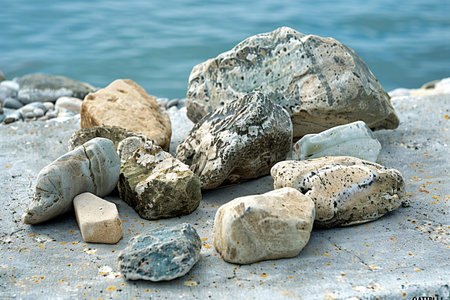 Pile of sea stones on the seashore in summer dayの素材