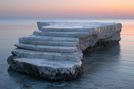 Winter seascape. Ice on the sea shore at sunset.の素材