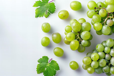Grapes with green leaves on white background. Top view.の写真素材