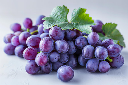Ripe purple grapes on a white background. Selective focus.の写真素材