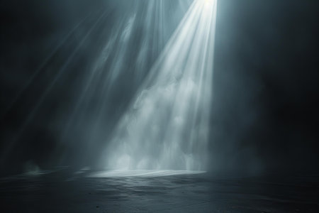 abstract dark scene with rays of light and smoke in the darkの写真素材