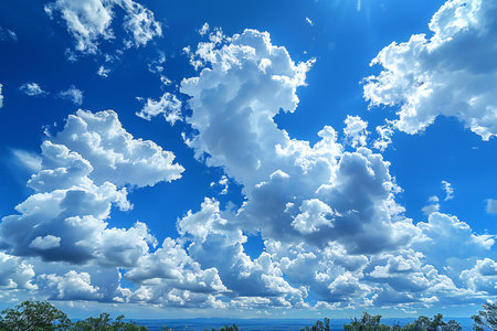 Blue sky background with white clouds. Cumulus clouds in the blue sky.の写真素材