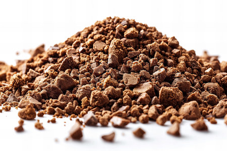 Heap of instant cocoa powder isolated on white background. Close up.