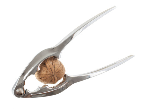 Nutcracker and nut isolated on a white background
