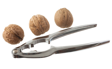 Nutcracker and nut isolated on a white background