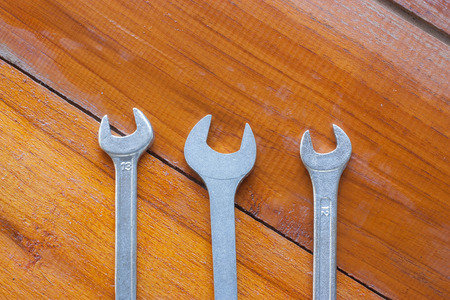 Wrench on wooden table の写真素材