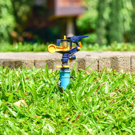 sprinkler on the green glass fieldの写真素材