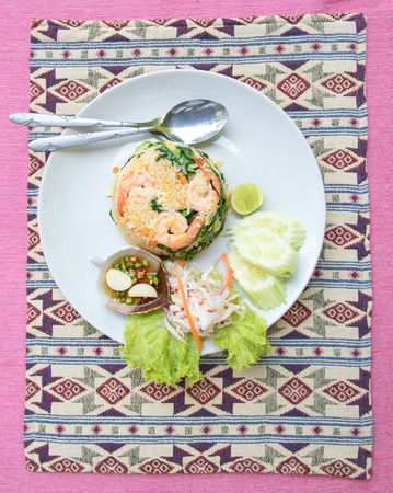 Fried  rice with shrimp set serve with fish sauce mixed with red chili and lime . (Thai food name is \"KHAOPAD\" )の写真素材