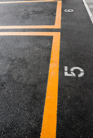 Parking lot with yellow line and slot numberの写真素材