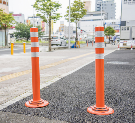 Red color traffic pole  which use as barrier to identify borderの写真素材