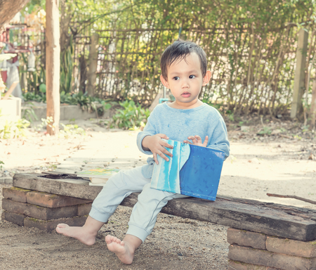 Asian baby boy  reading tale bookの写真素材