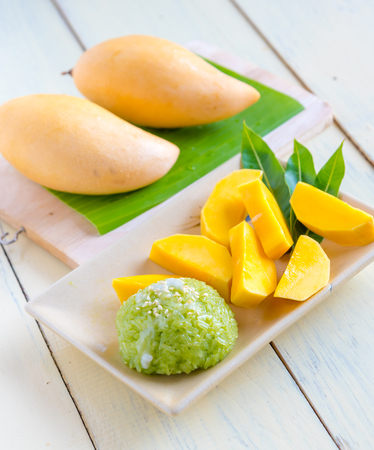 Thai style tropical dessert, sticky rice mixed coconut milk  with mangoの写真素材
