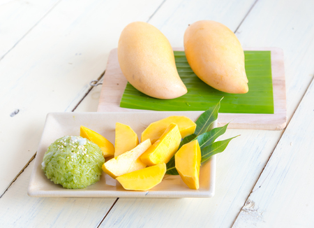 Thai style tropical dessert, sticky rice mixed coconut milk with mangoの写真素材
