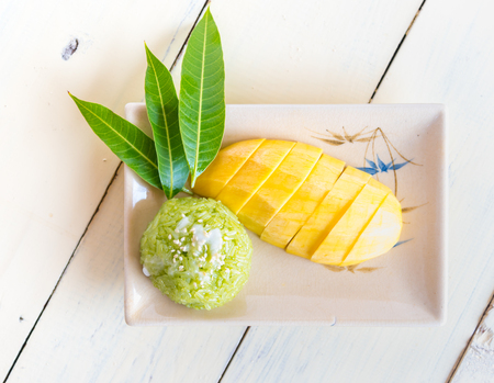 Thai style tropical dessert, sticky rice mixed coconut milk with mangoの写真素材