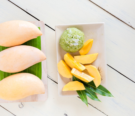 Thai style tropical dessert, sticky rice mixed coconut milk  with mangoの写真素材