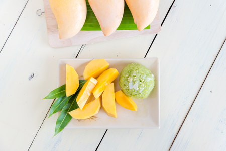 Thai style tropical dessert, sticky rice mixed coconut milk with mangoの写真素材