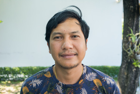 Portrait of a smiling Asian man , Thailandの写真素材
