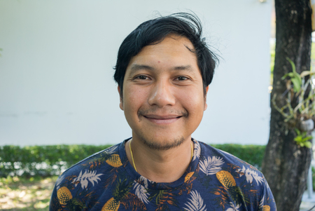 Portrait of a smiling Asian man , Thailandの写真素材