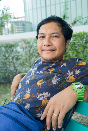Portrait of a smiling Asian man , Thailandの写真素材