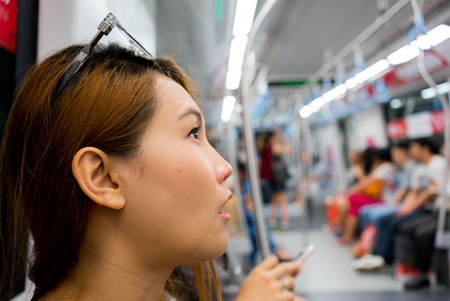 lifestyle portrait of pretty young woman wear sunglasses having fun in the city in Asian Singapore camera travel photo of photographerのeditorial素材