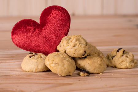 Currant Cookies on wood table with heart , homemade food.の写真素材