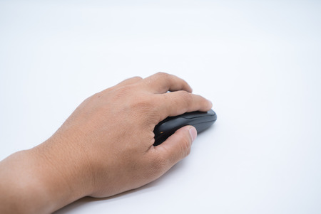 Human hand on computer mouse with white background.