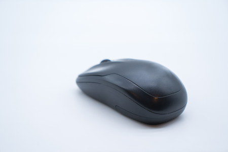 black computer mouse on a white backgroundの写真素材